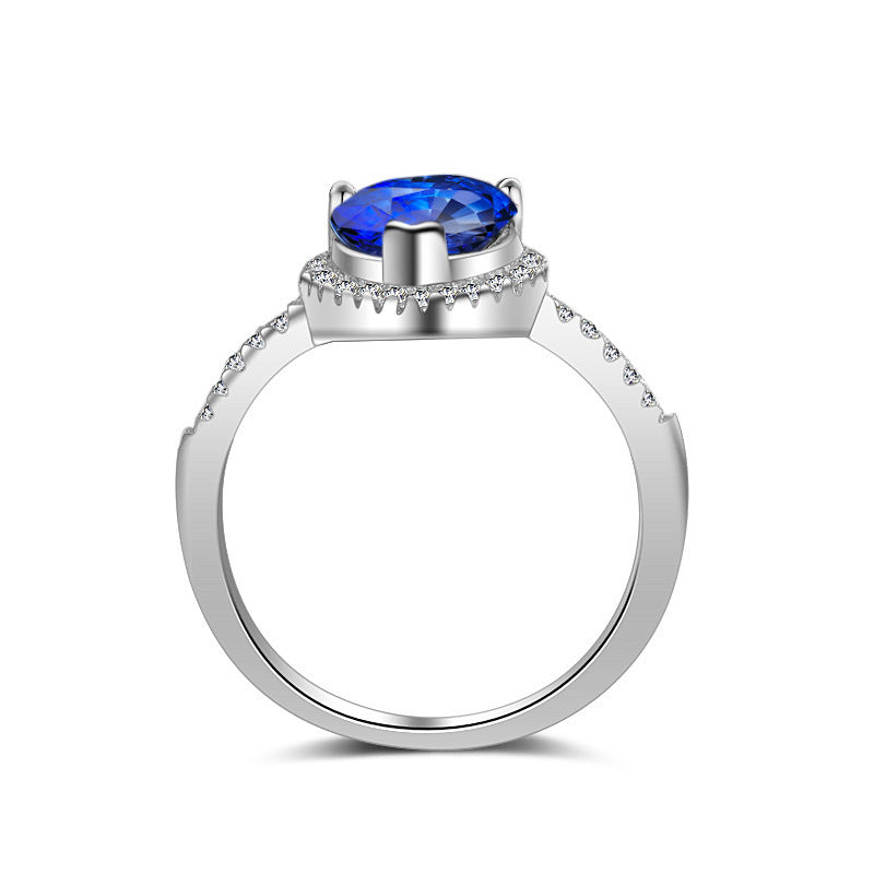 Ring mit blauem oder weißem Stein