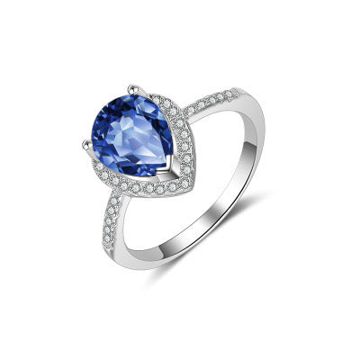 Ring mit blauem oder weißem Stein