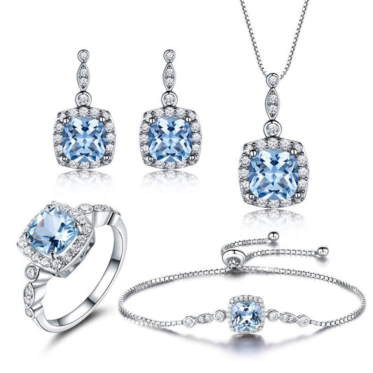 Wunderschönes vierteiliges Set: 925 Sterling Silber mit himmelblauem Topas